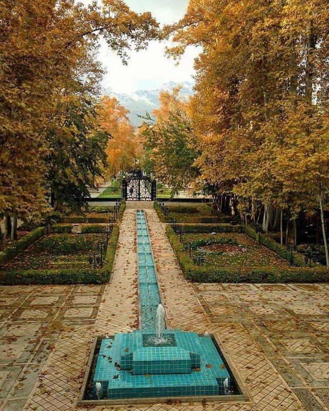 A Persian garden with a turquoise-tiled water channel